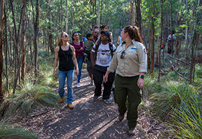 A Tidbinbilla Ranger leading a group on a walking tour.
